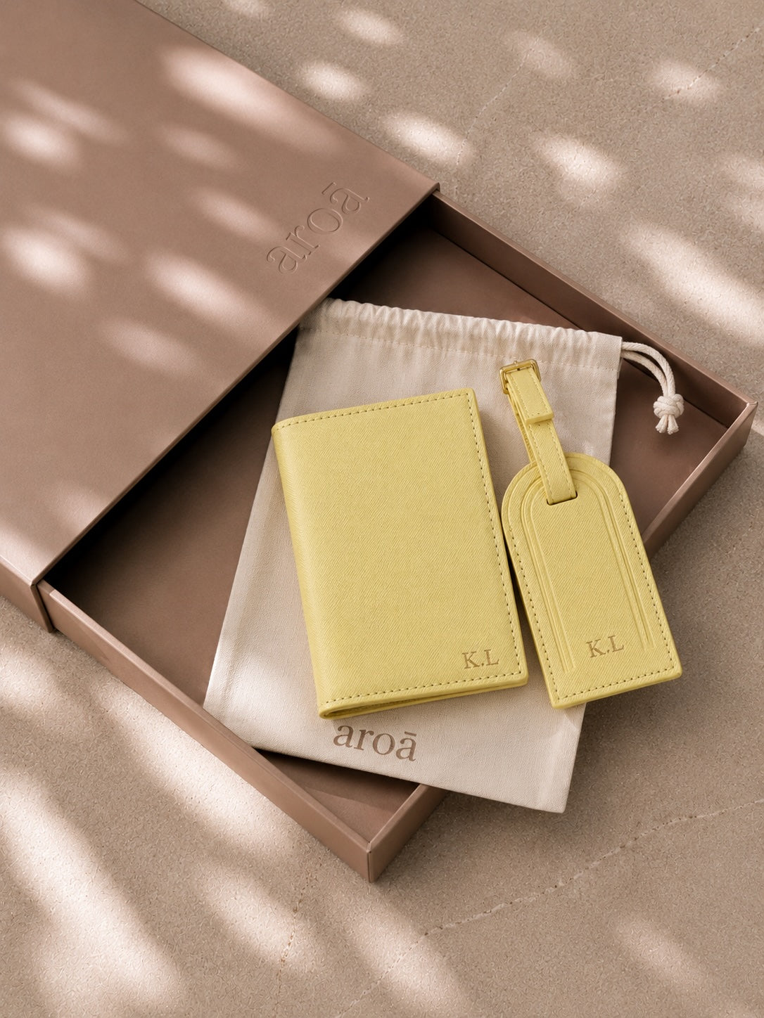 yellow personalised passport cover and luggage tag in aroa gift box with cream pouch
