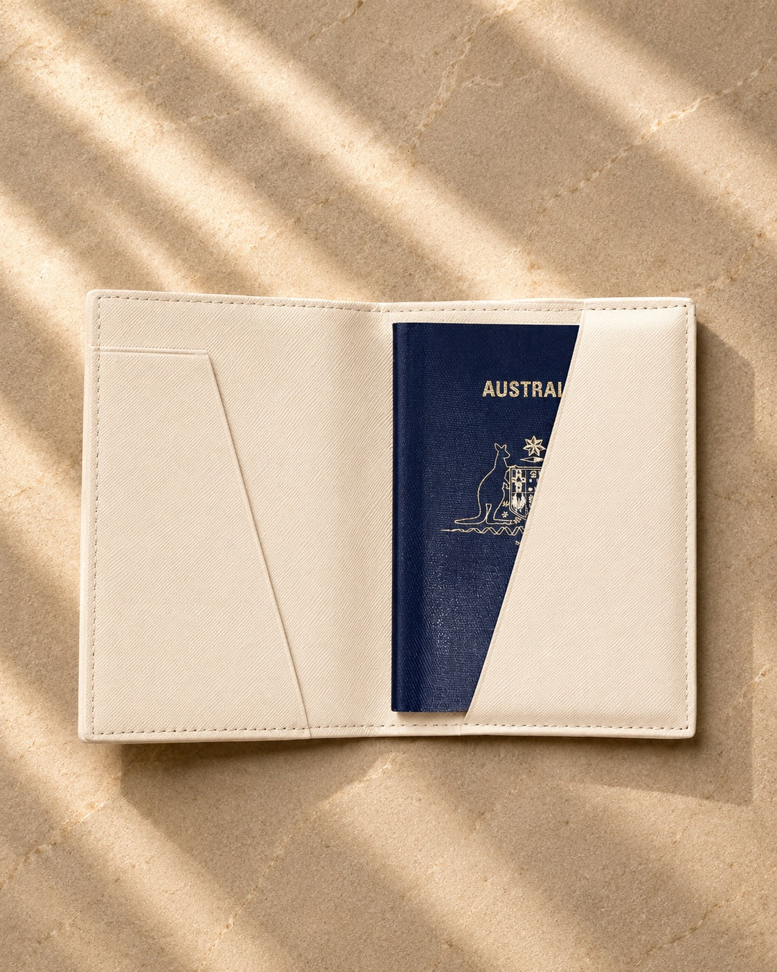 ivory passport cover open with an australian passport inside