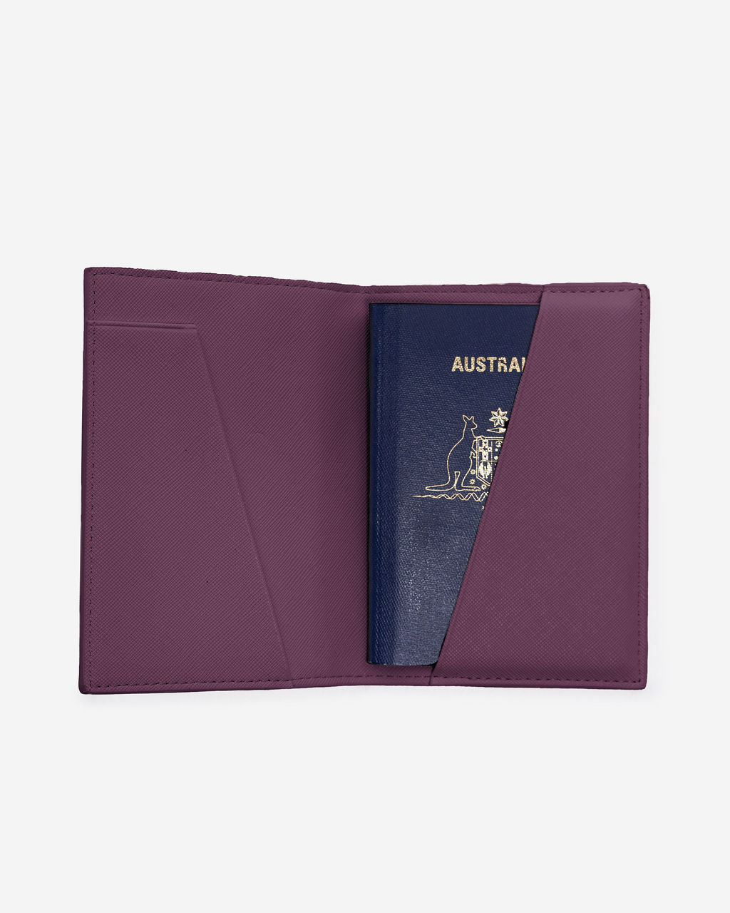 Open burgundy-colored Saffiano leather passport holder displays an Australian passport partially inserted into the right-hand pocket.