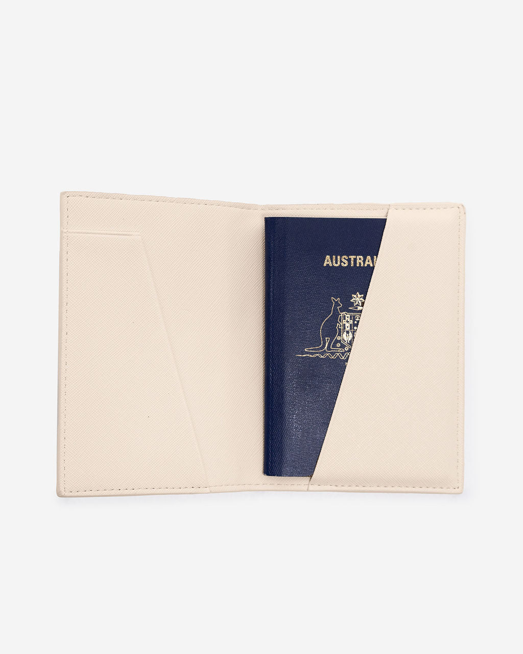 Open cream-colored Saffiano leather passport holder displaying a partially inserted Australian passport on a white background.