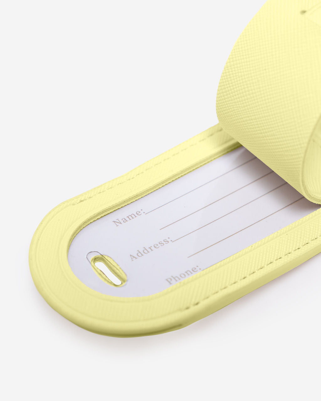 Personalised passport holder and luggage tag set featuring a yellow luggage tag with space for name and contact details.