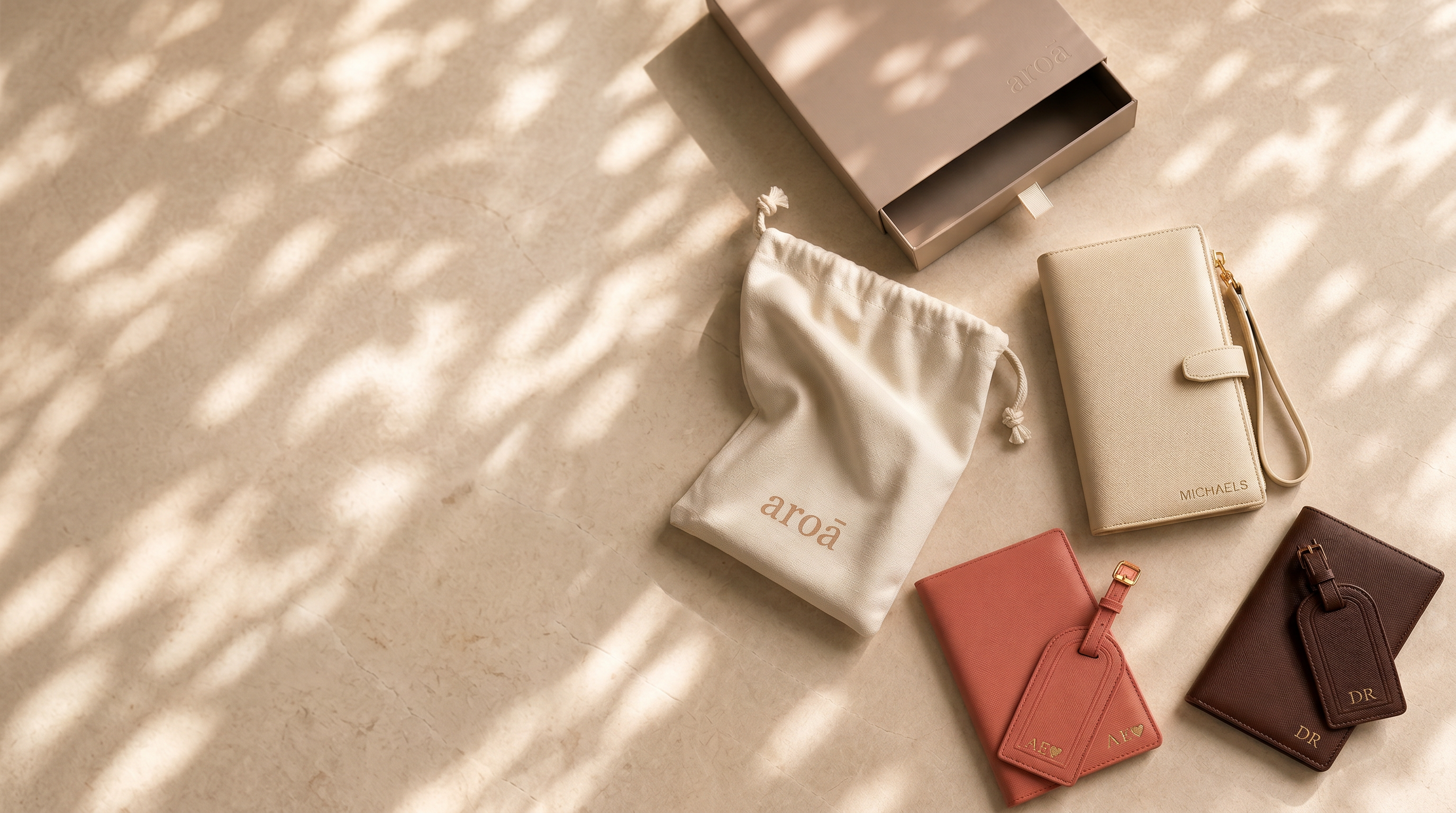 collection of travel accessories, travel wallets, luggage tags, passport covers with branded packaging and embossing